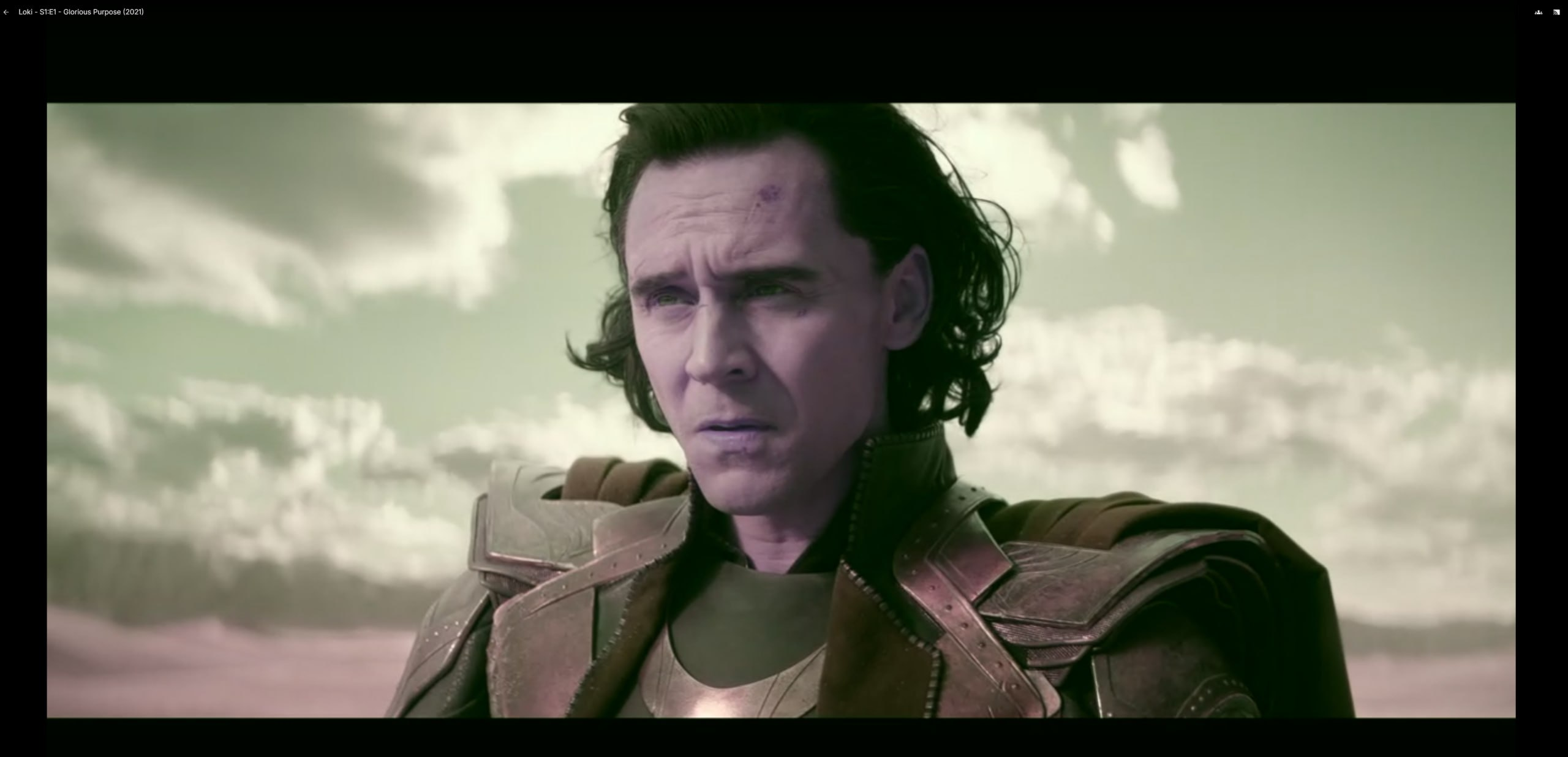 A screenshot of a close-up of Loki from the first episode in which the color space is off, making him look tinted purple